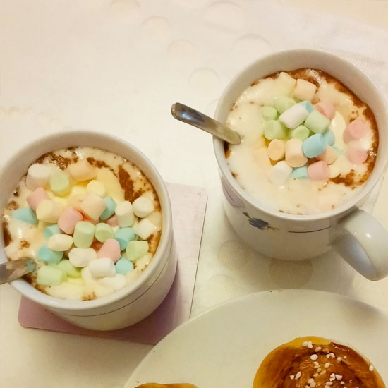 Cup of Hot Choclate with Wipped Cream and Mini Marshmallows in different pastel colours